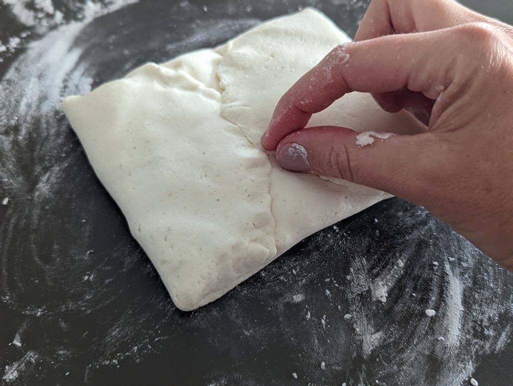 sealing gluten free stuffed flatbread dough